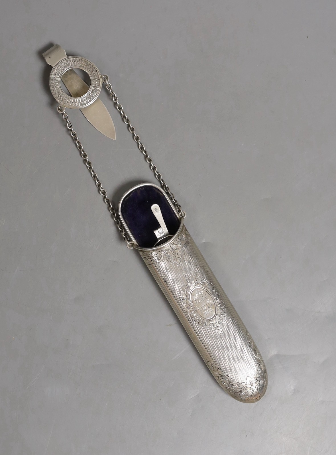 A late Victorian engine turned silver spectacles case, Saunders & Shepherd, London 1900, 17cm containing an earlier pair of Georgian silver spectacles by Joseph Wilmore.